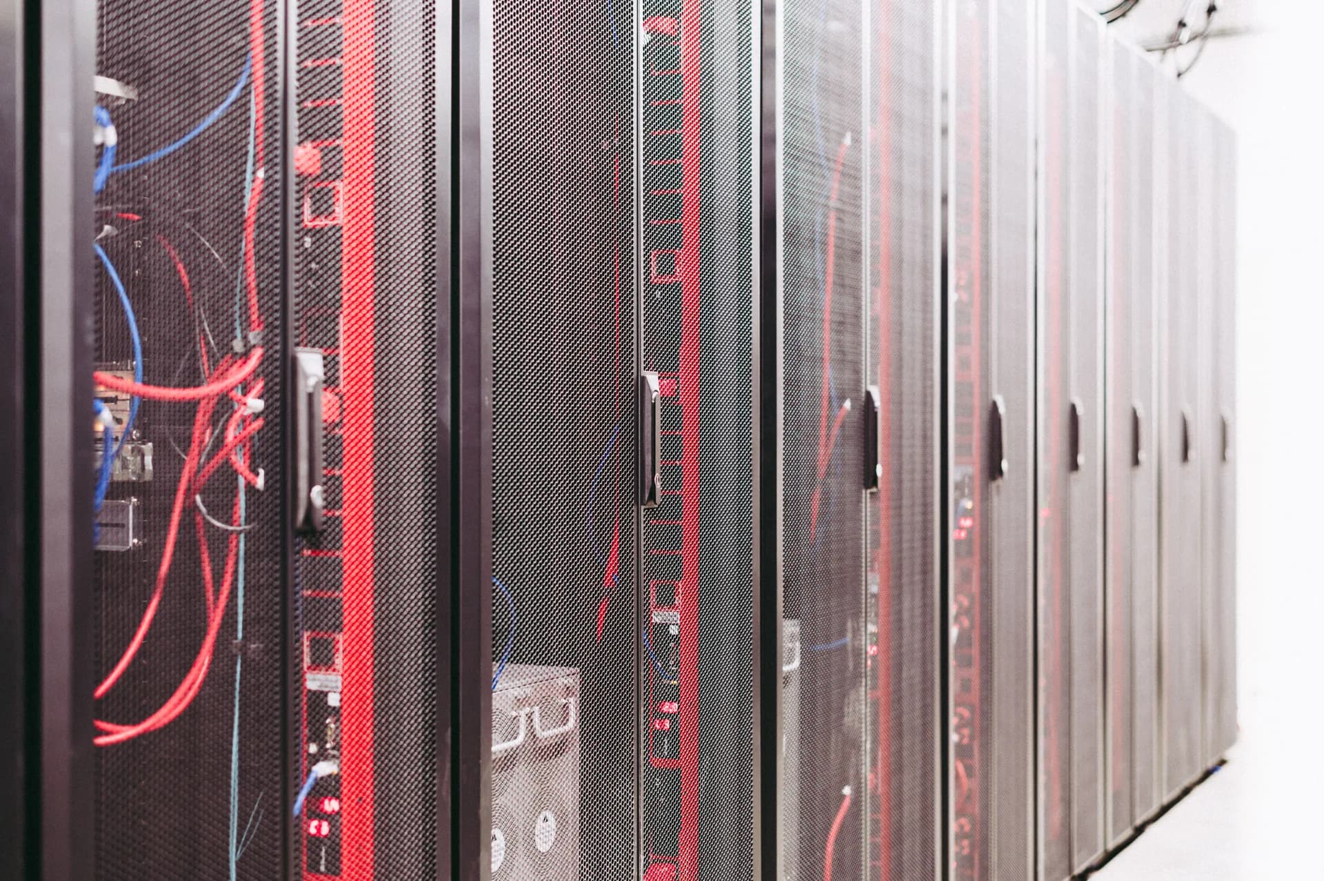 Wide view of a data center aisle with server racks