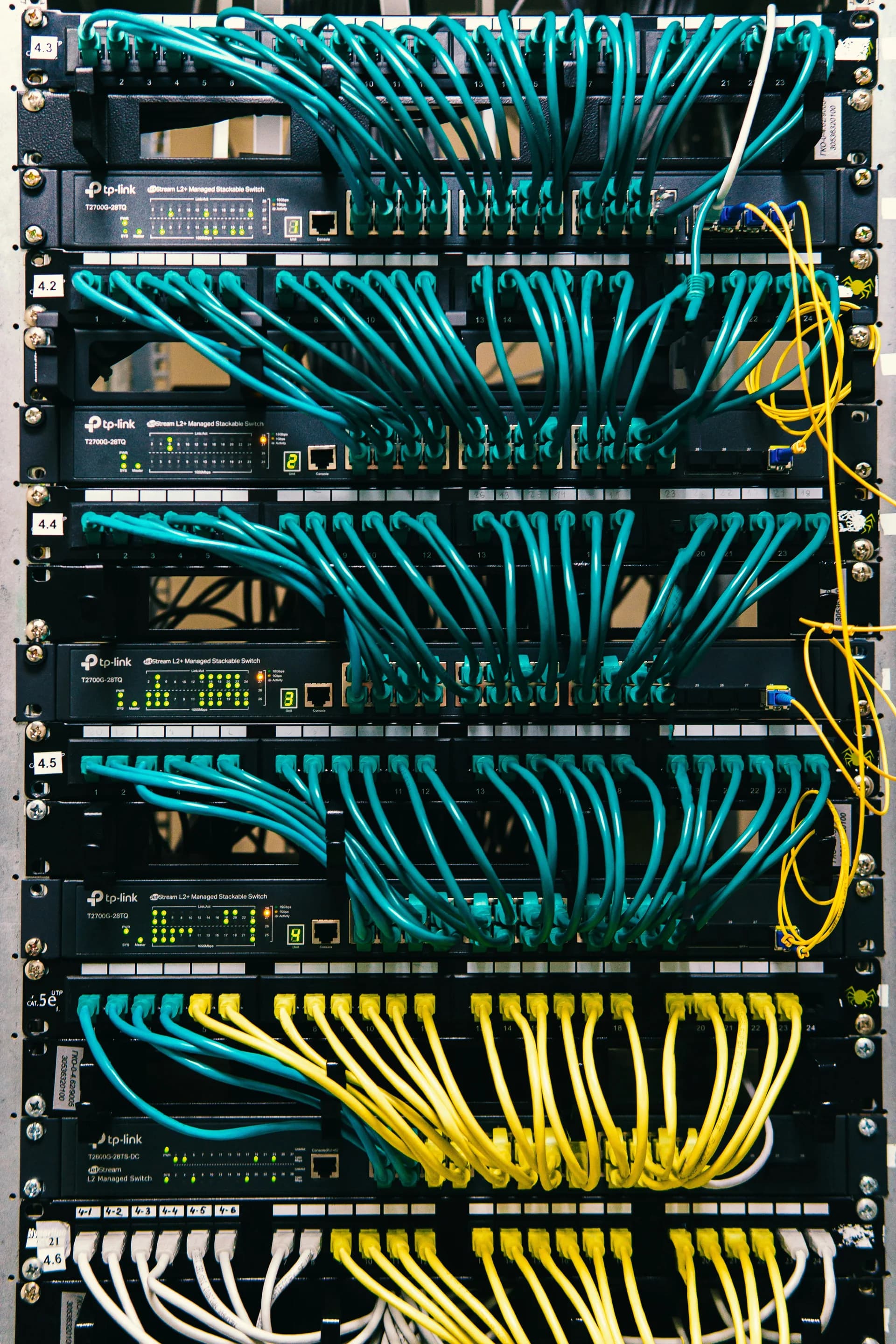 Managed network switch with patch cables connected to multiple ports