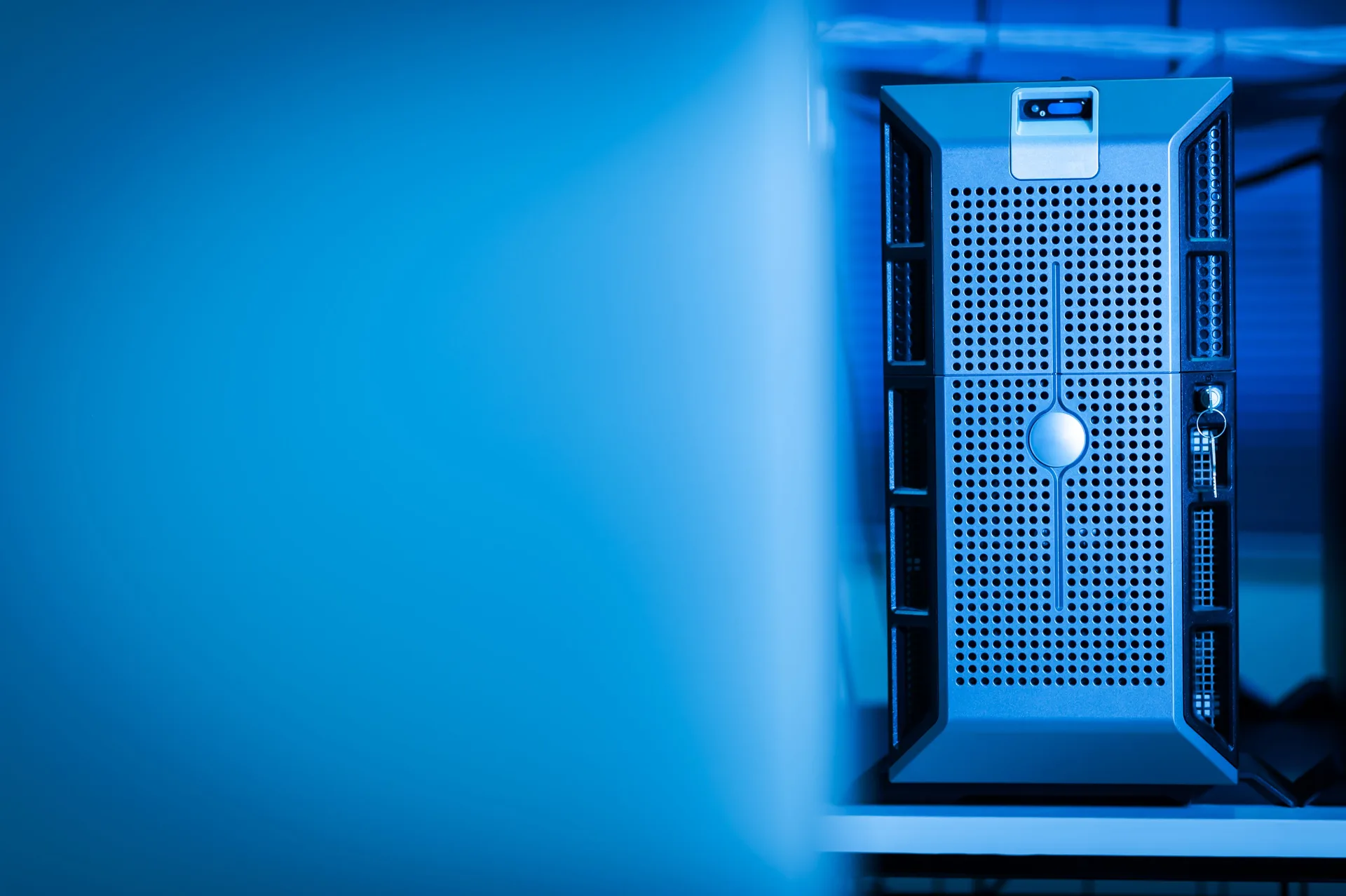 IT hardware unit lit in blue, ventilation grille detail